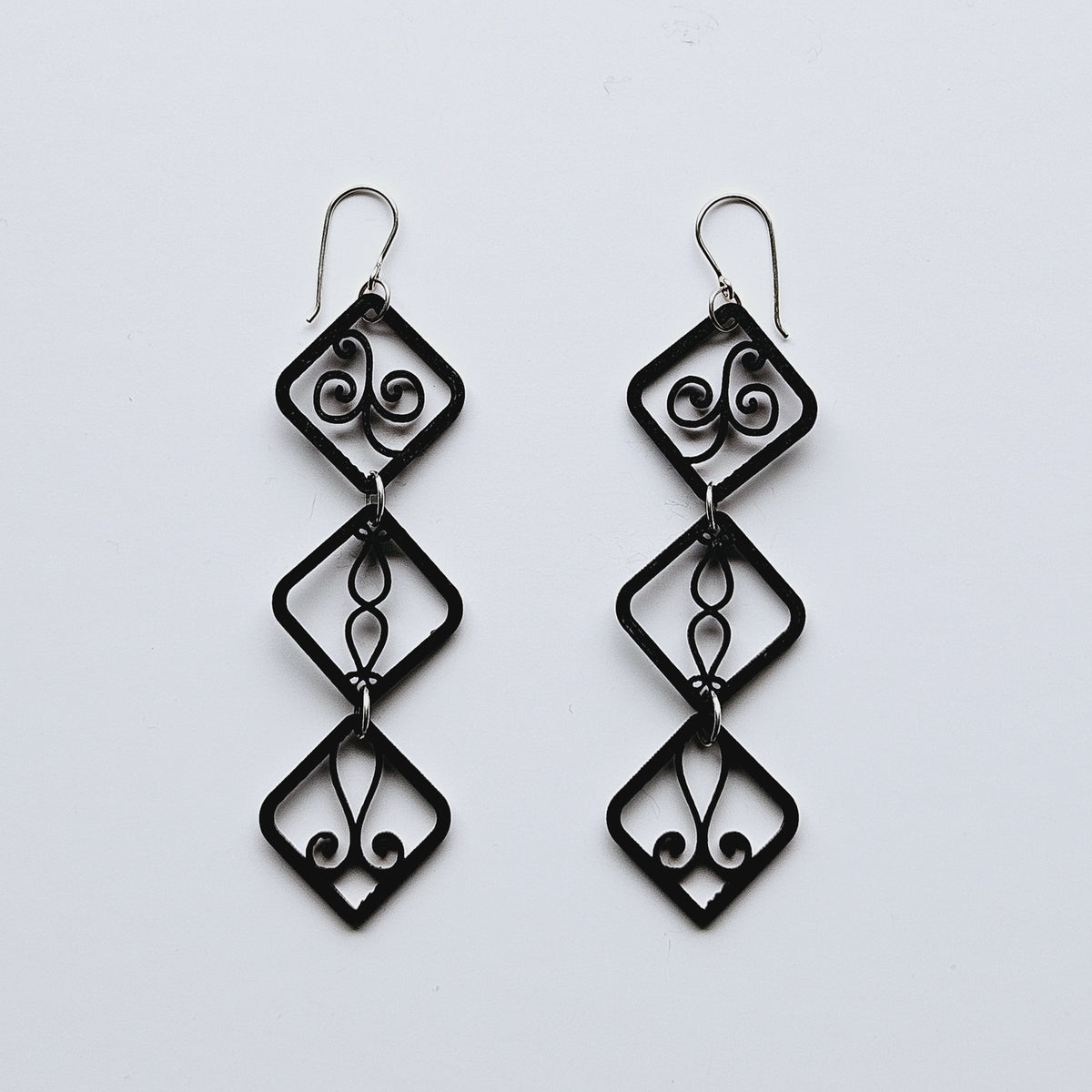 Wooden earring made of decorative squares