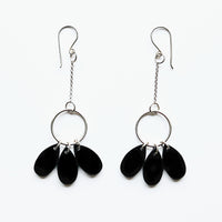 Silver earrings and three drops