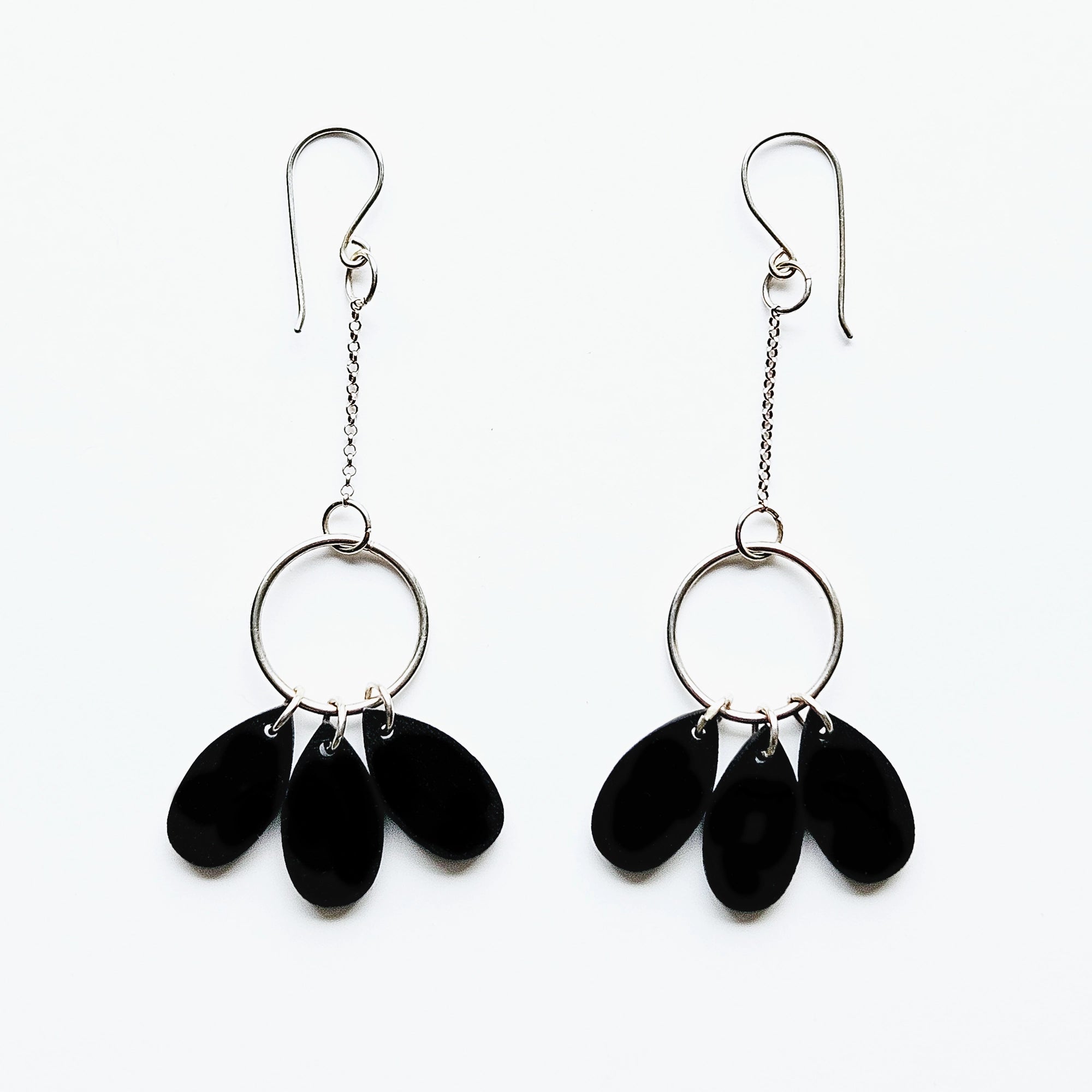 Silver earrings and three drops