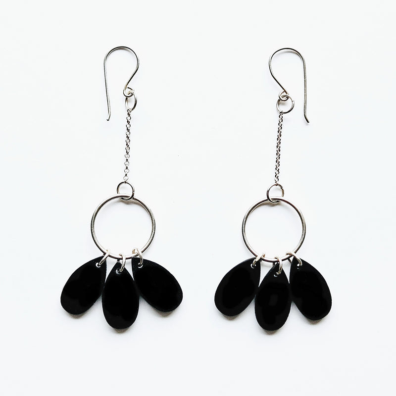 Silver earrings and three drops